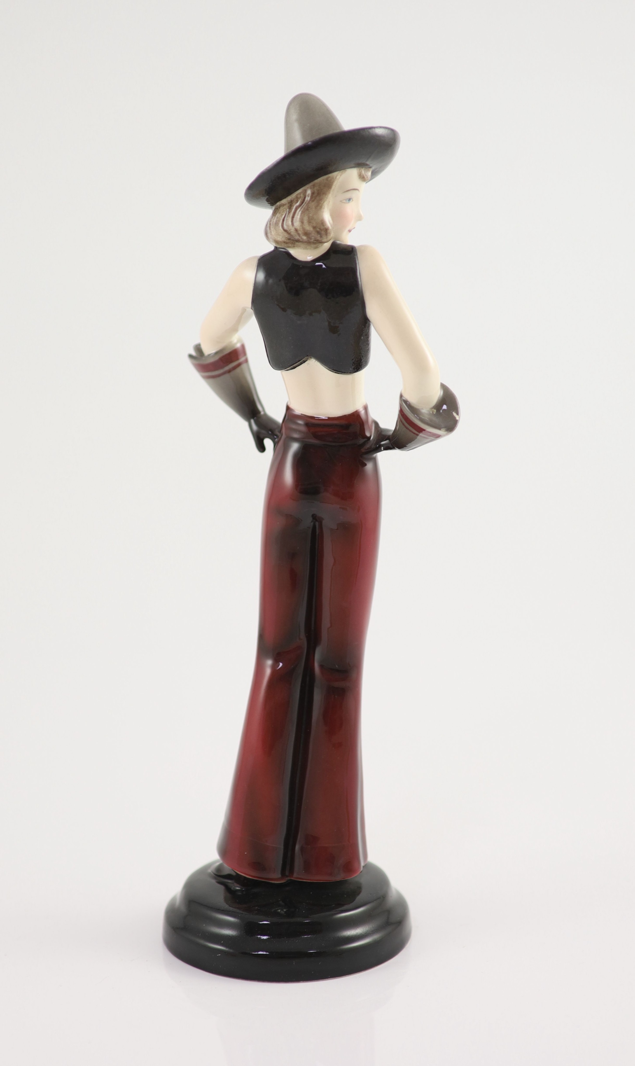 Stefan Dakon for Goldscheider, an Art Deco pottery figure of a girl wearing a Sombrero, c.1935, 30.5cm high